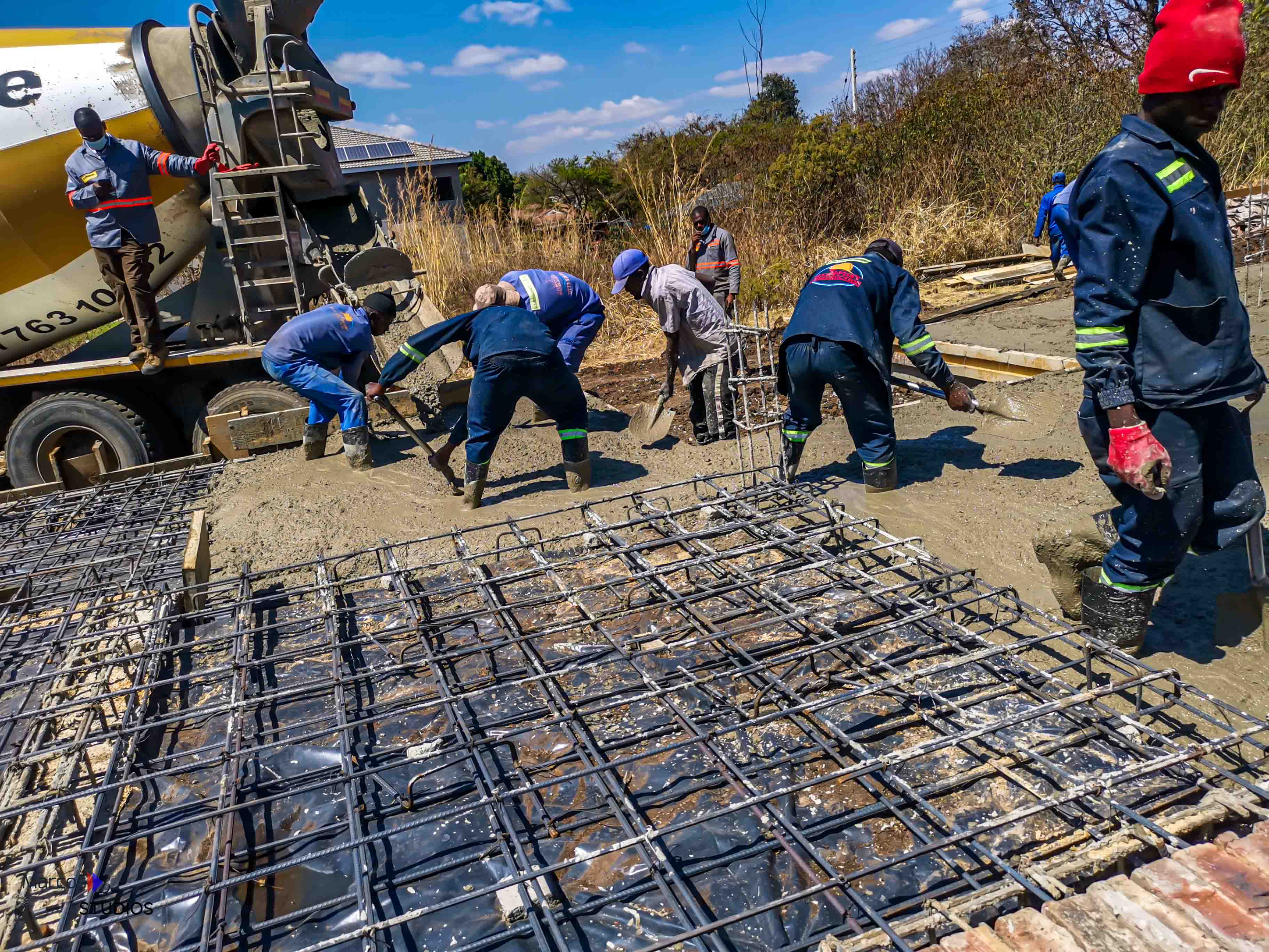 Martcosy Construction crew placing concrete reinforcement on a residential site